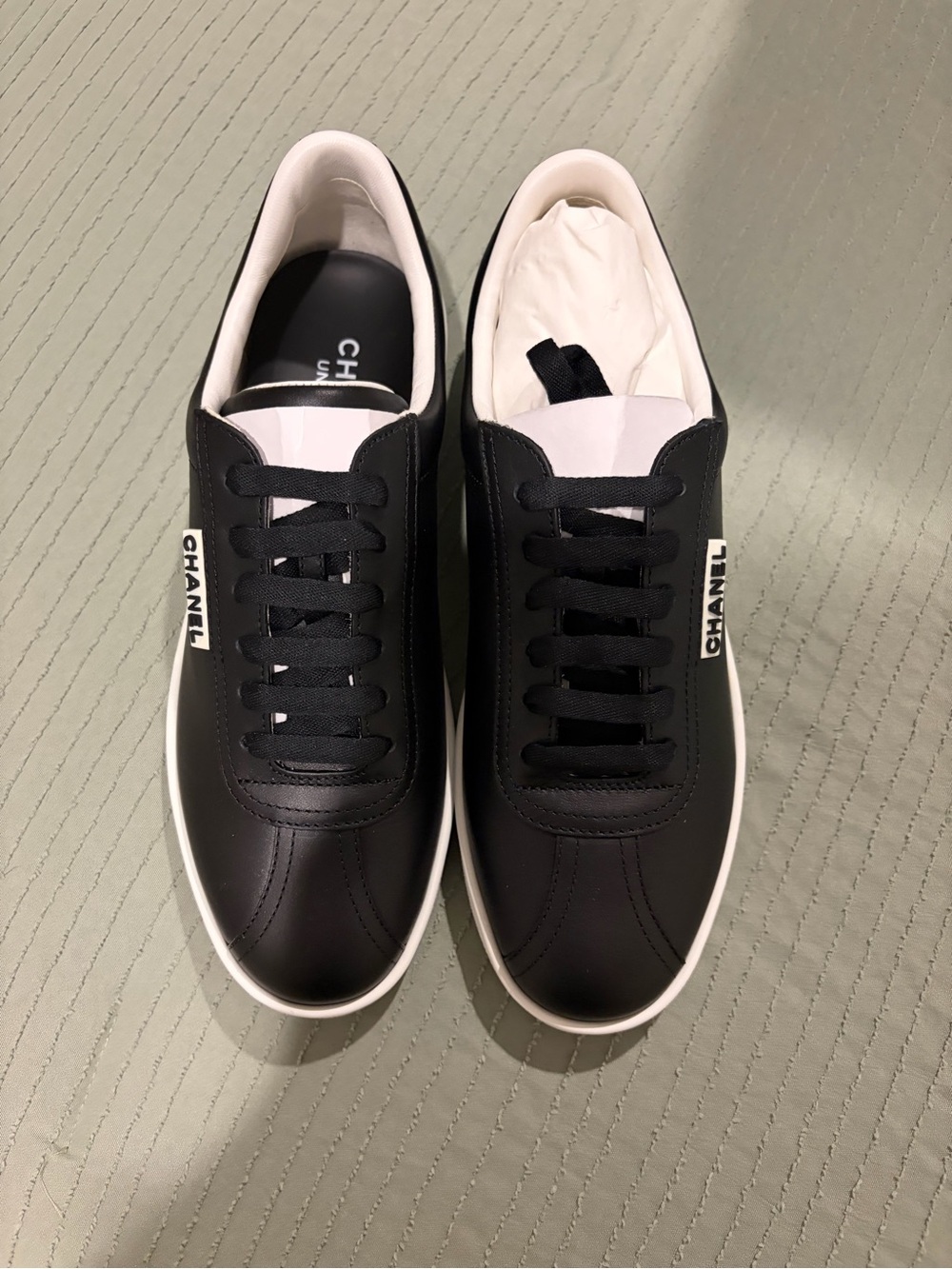 CHANEL womens Black Leather Low-Top Sneakers